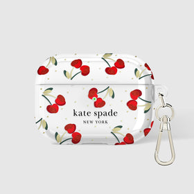 kate spade new york Cherry Dot clipped to a bag showing on-the-go convenience