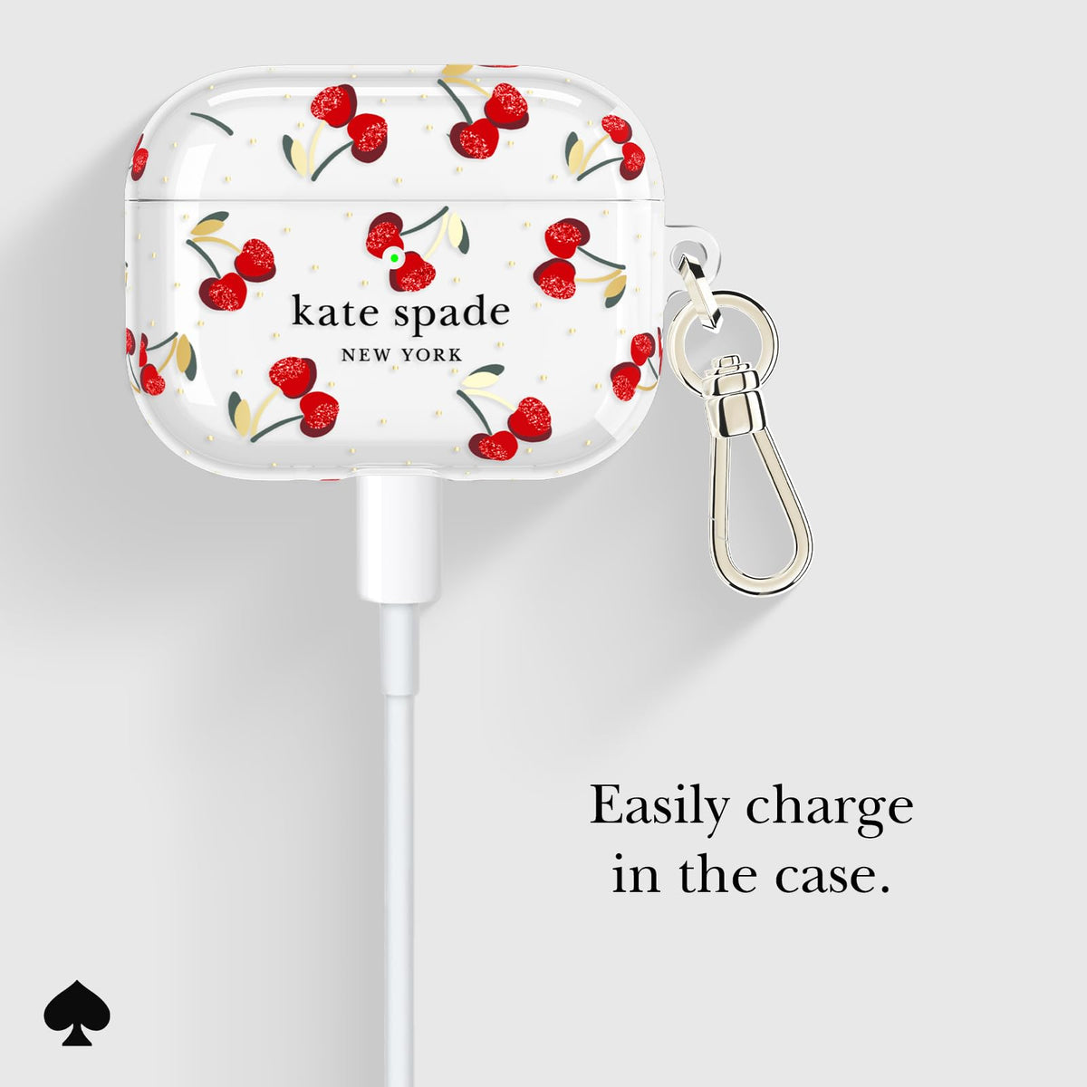 kate spade new york case beside keys showing compact size and portability