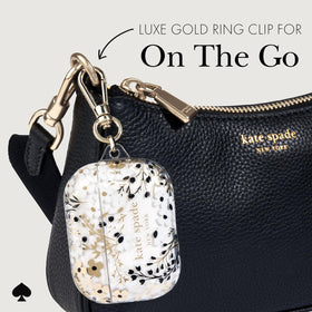 kate spade new york next to keys showing compact scale and pocket-friendly benefit