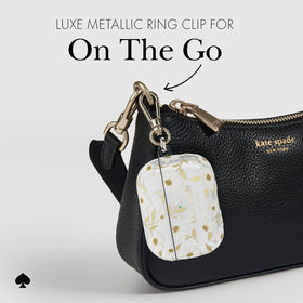 kate spade new york case beside keys showing size and portability benefit