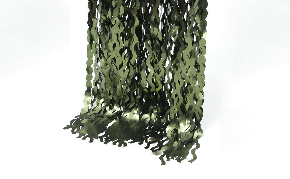 Keeuh green foil fringe curtain complements LED lights and balloons.