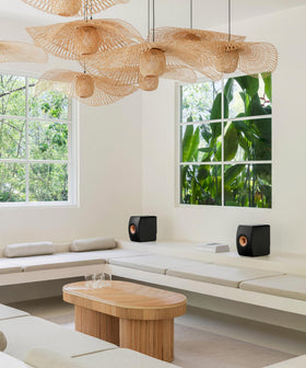 KEF LS50 Wireless II in a living room setup demonstrates room-filling stereo.