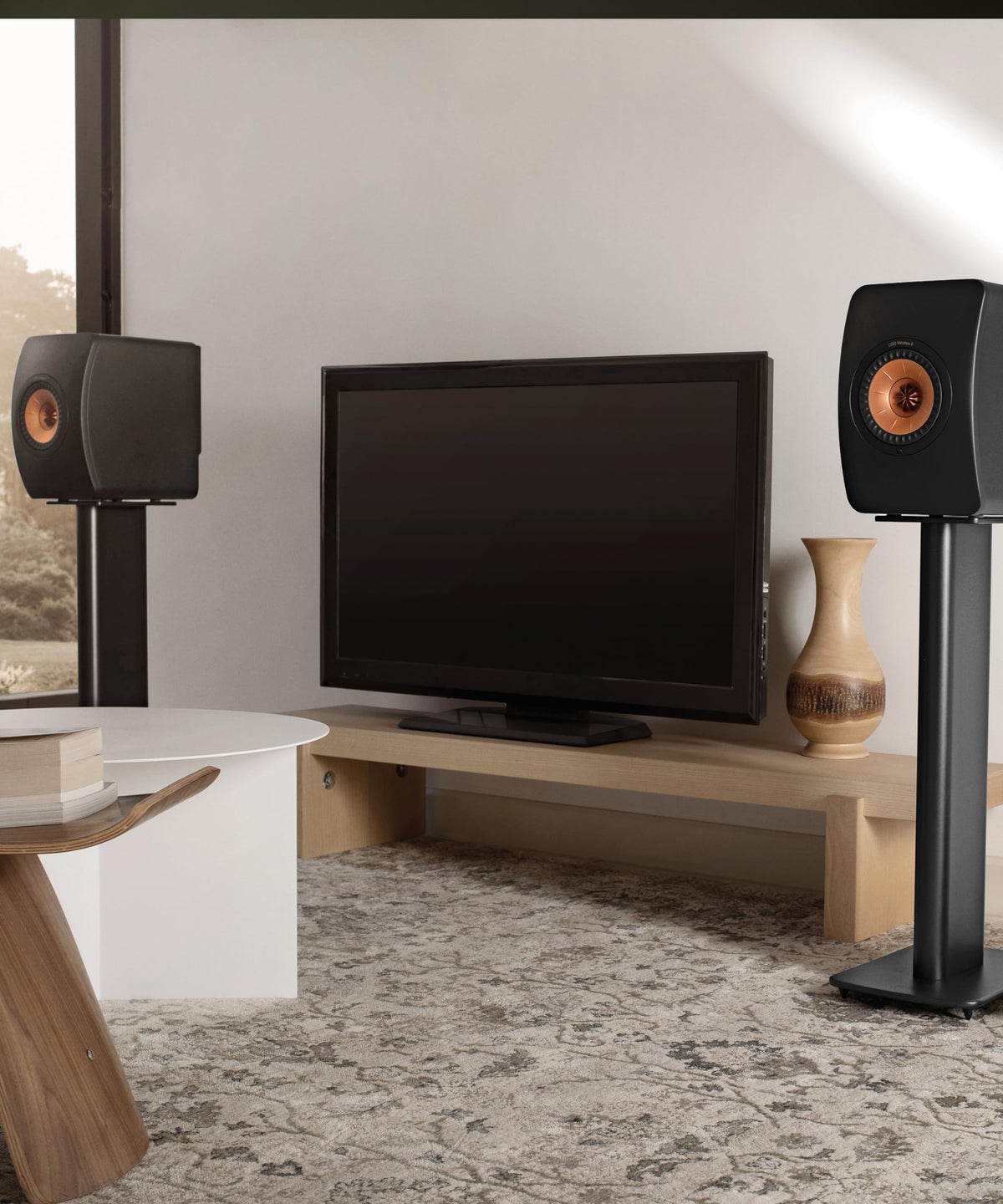 KEF LS50 Wireless II rear panel shows HDMI eARC and versatile inputs for setup.