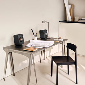 KEF LSX II wall-mount-ready carbon black panel shows flexible placement