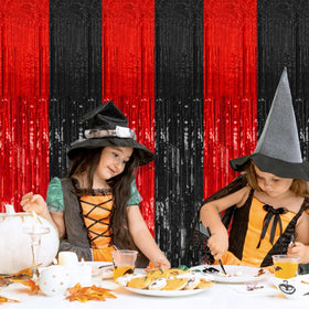 K.E.J. foil fringe curtains drape walls with shimmer for photos and ambiance.