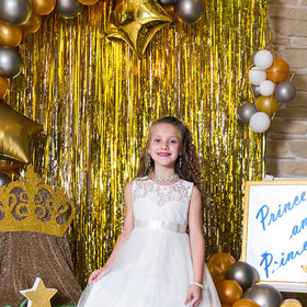 K.E.J. gold foil curtain backdrop suits baby showers and holiday celebrations with shimmer.
