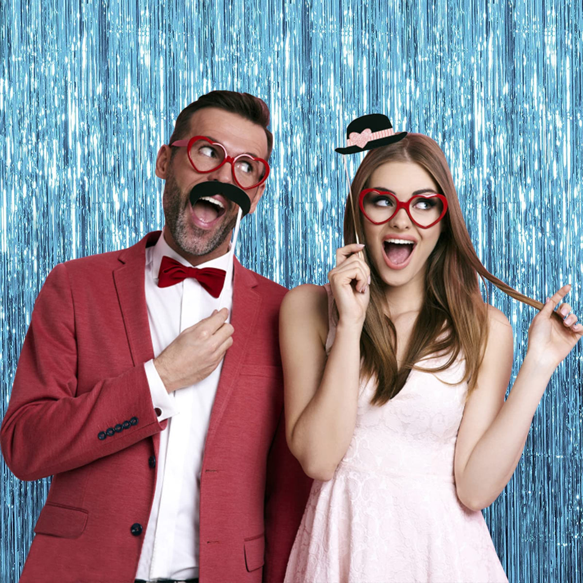 K.E.J. blue-tinsel backdrop for holiday celebrations.