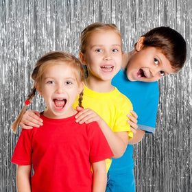 K.E.J. foil curtain silver photo booth backdrop supports memorable portraits.