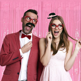 K.E.J. pink foil curtain used as photo booth backdrop adding glam to photos