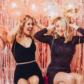 K.E.J. rose gold fringe curtains create a shimmering entrance vibe