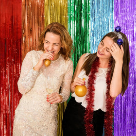 K.E.J shiny backdrop enhances baby shower decor with reflective fringe