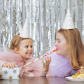 K.E.J. tinsel curtain silver adds sparkle to wall decor and events.
