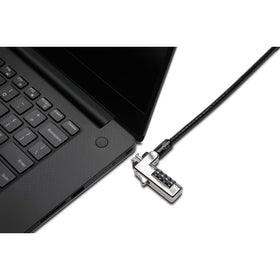 Laptop anchored to desk with Kensington cable showing stability and theft deterrence