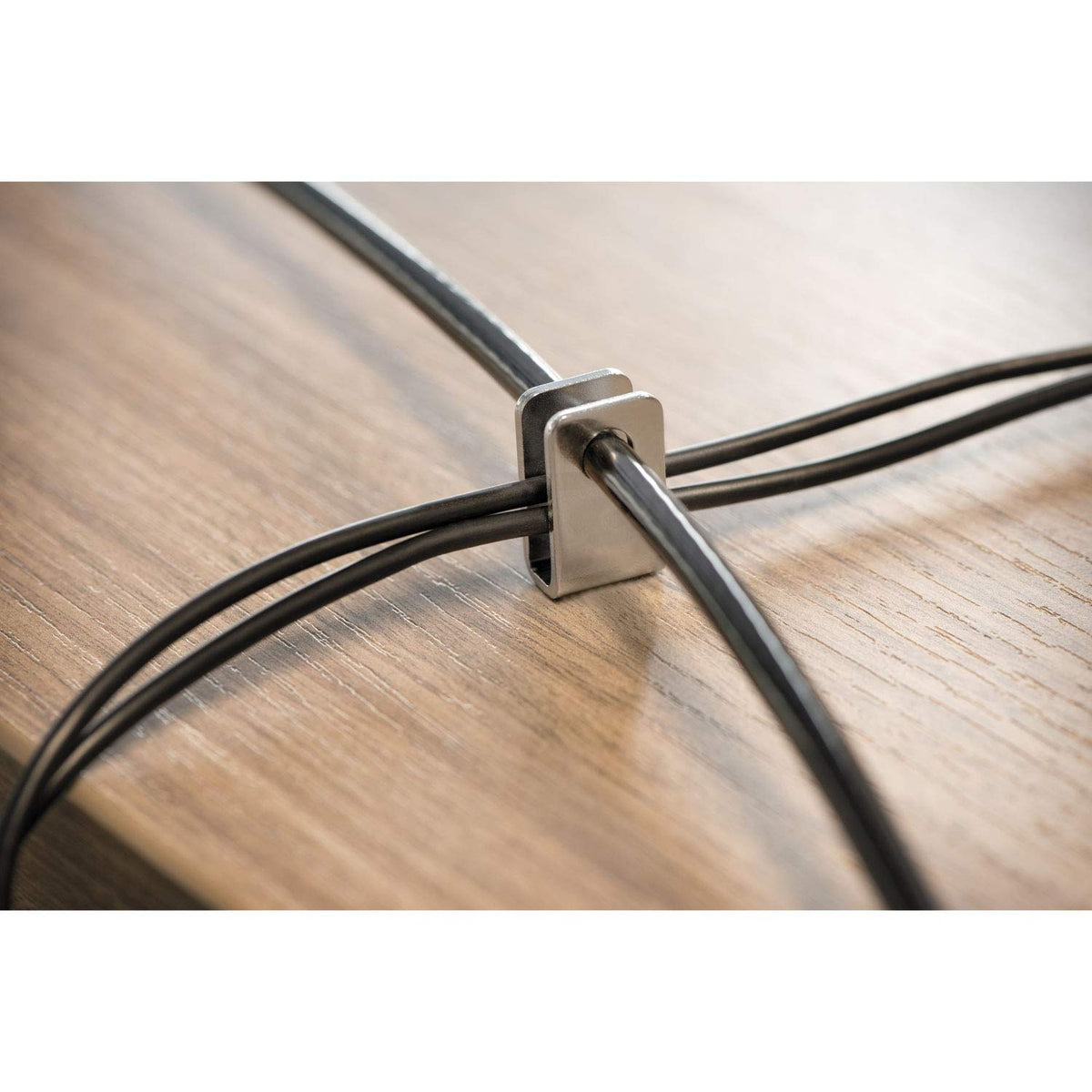 Kensington peripheral adapters attached to accessories securing multiple devices