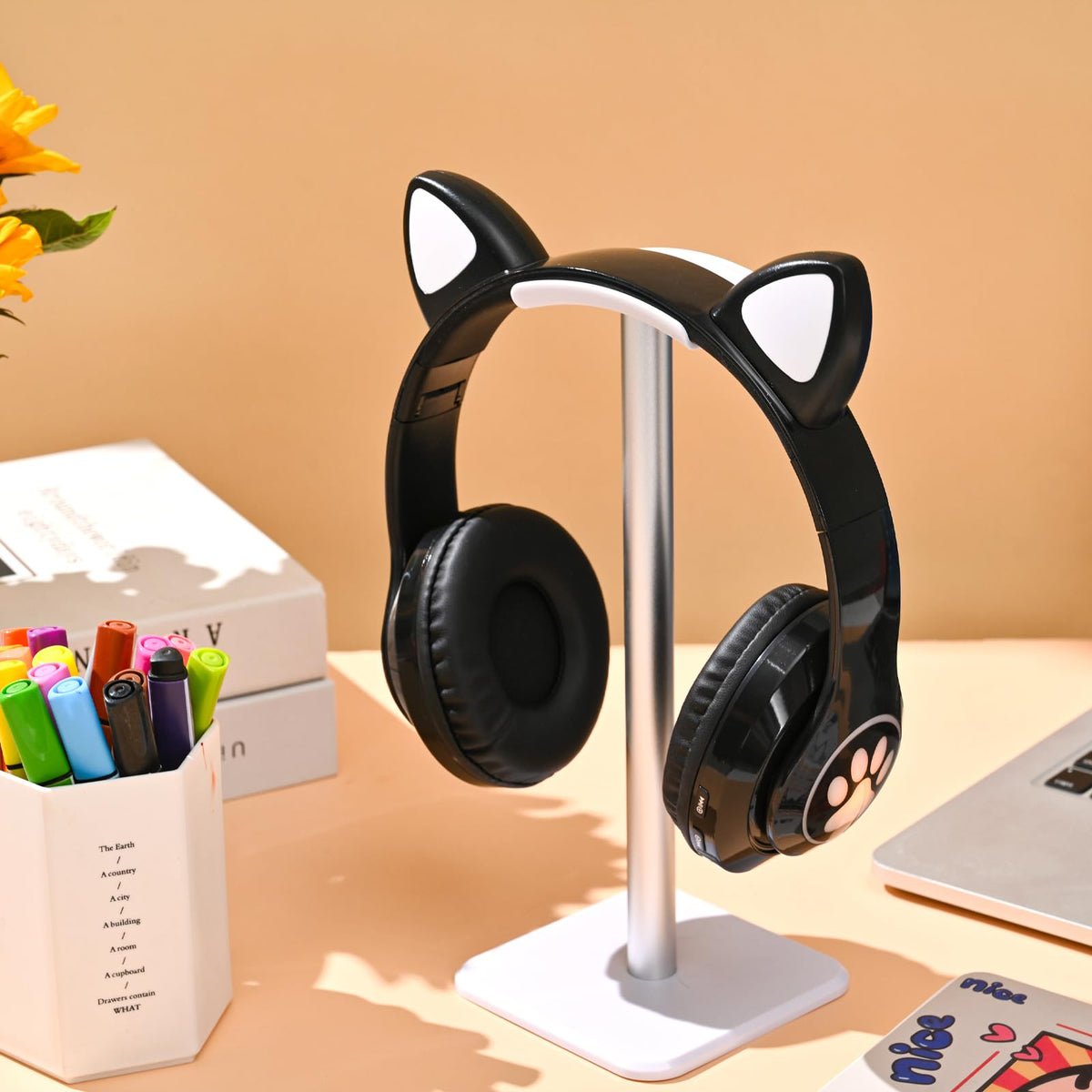 KERHAND kids cat-ear headphones folded for compact travel and easy storage.