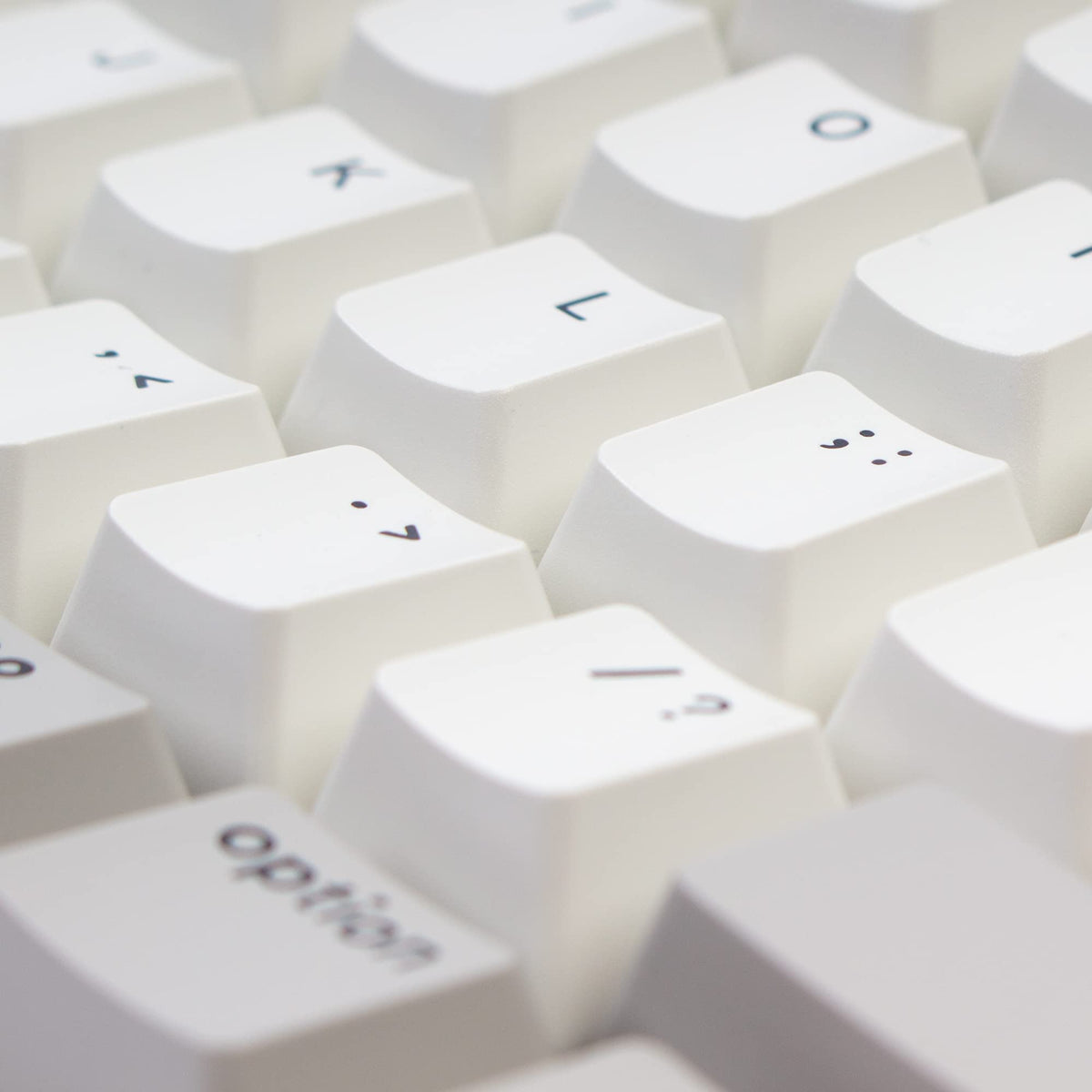 Keychron side profile with adjustable feet showing tilt angles for comfortable typing benefit