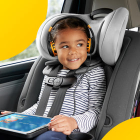 Kidrox toddler wearing headphones on airplane providing quiet travel entertainment