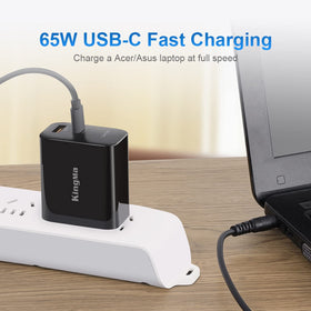 King Ma charger plugged into wall powering laptop and phone on a workspace for multitasking