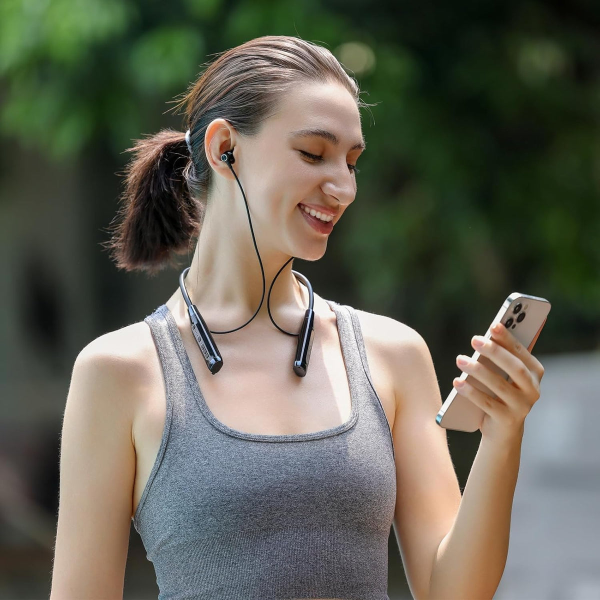 Kinobo earbuds with water splashes illustrating IPX7 protection for active use benefit