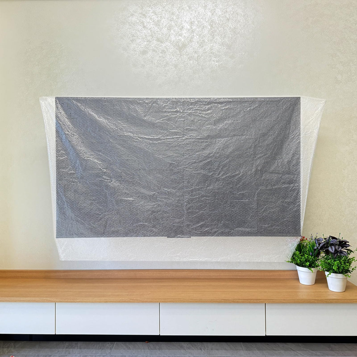 KIXILO TV Cover also protects photo frames and mirrors during storage.