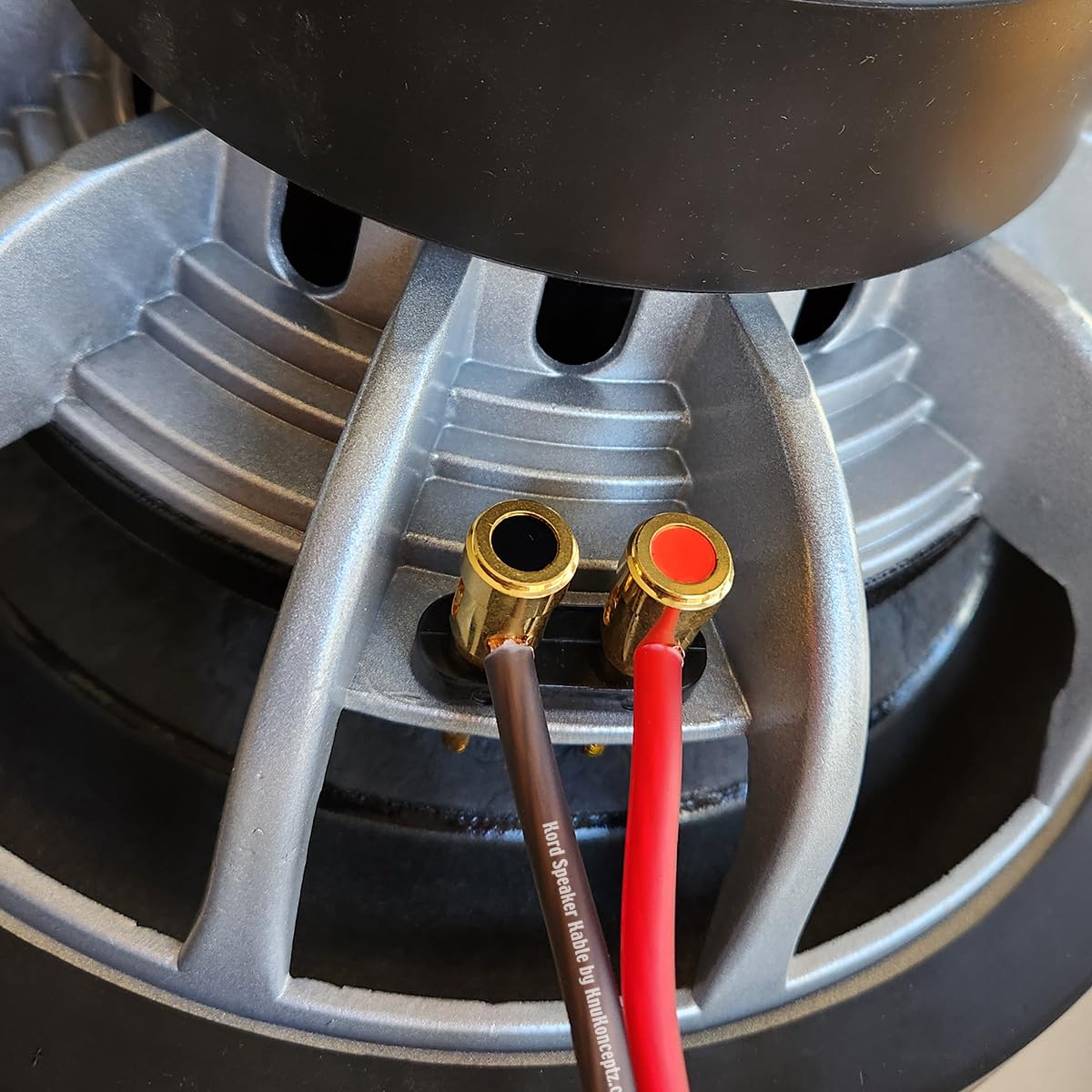 KnuKonceptz 50ft cable beside a tape measure showing scale for planning long runs