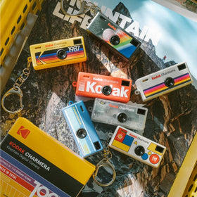 KODAK CHARMERA beside a coin to show scale for easy portability