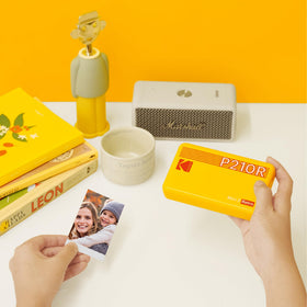 KODAK Mini 2 Retro printed photos for wallets or scrapbooks.