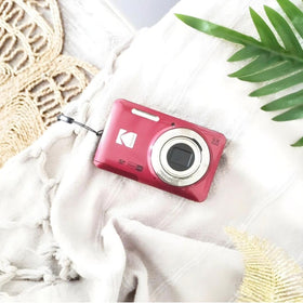 Kodak PIXPRO FZ55-RD in hand showing slim profile for quick spontaneous shots.