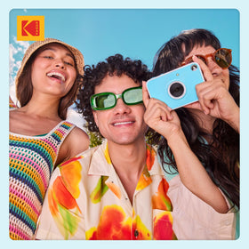 Kodak Printomatic in outdoor scene showcasing portable design.