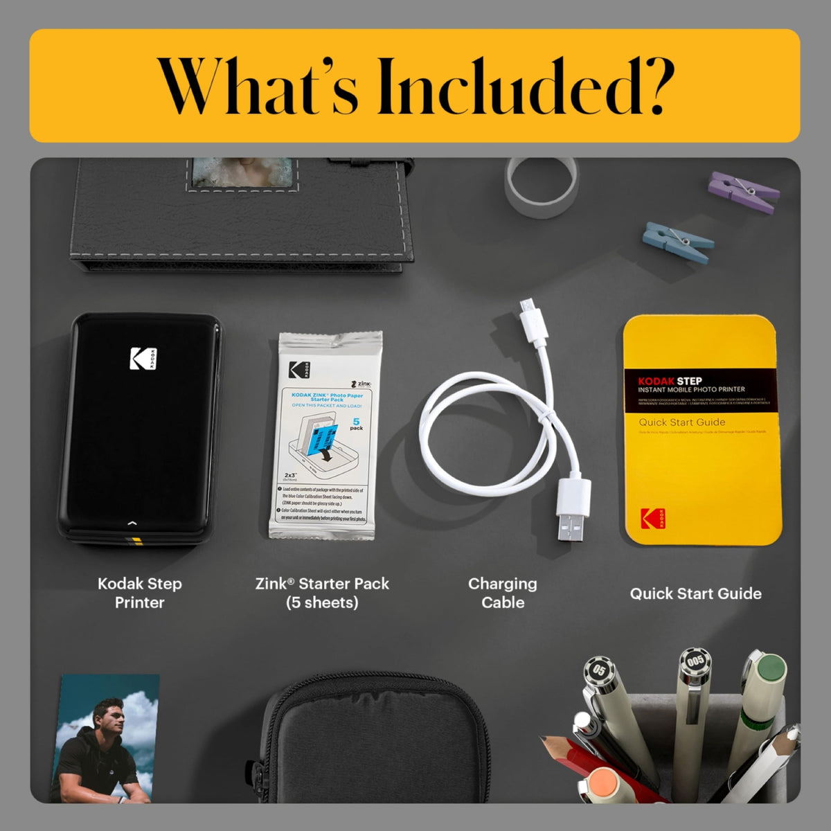 KODAK Step printer in hand, ready for instant on-the-go prints.