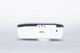 Camera back/top view highlighting compact weight and simple controls.