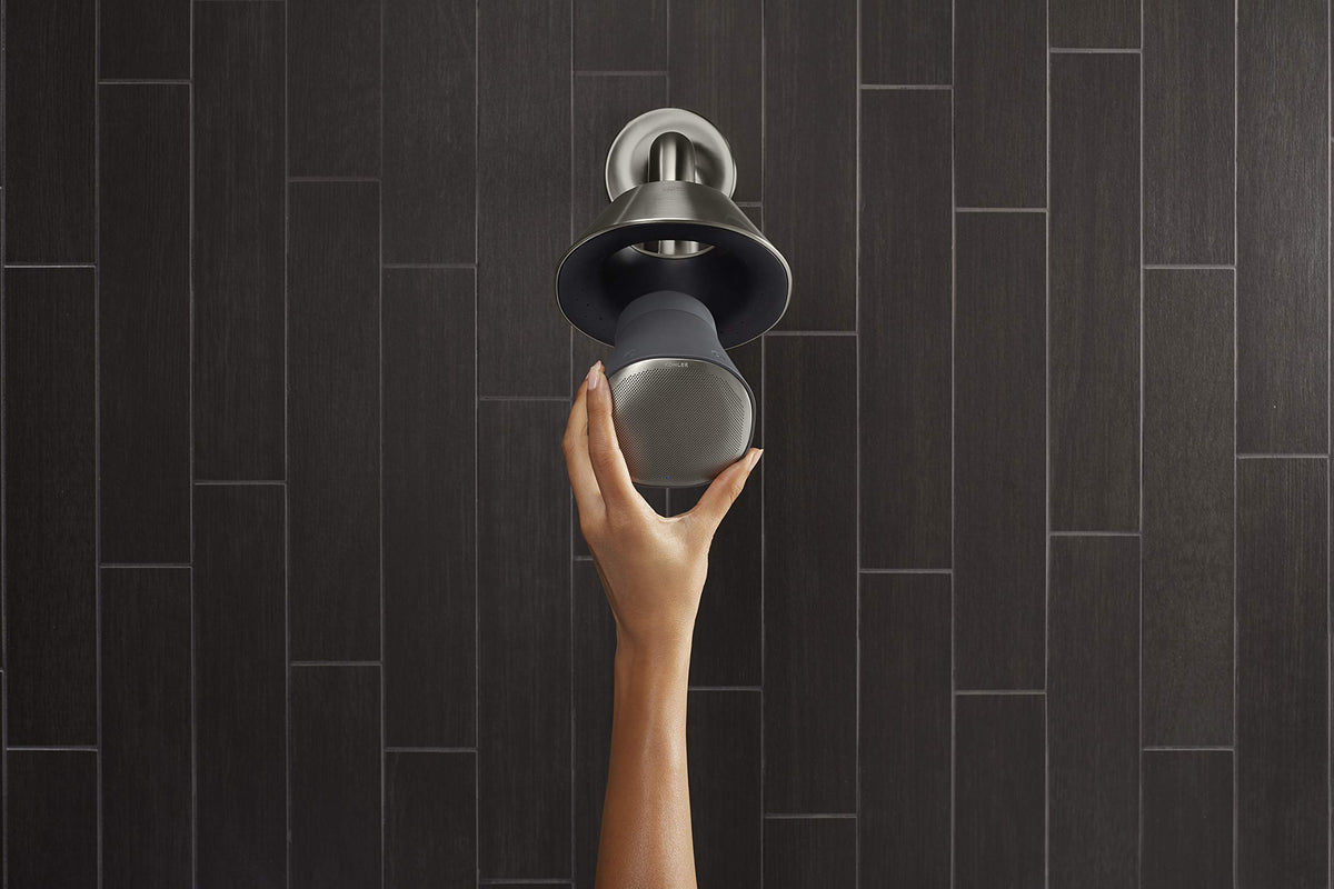 Kohler Moxie speaker close-up highlighting Harman Kardon audio branding.