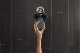 Kohler Moxie speaker close-up highlighting Harman Kardon audio branding.