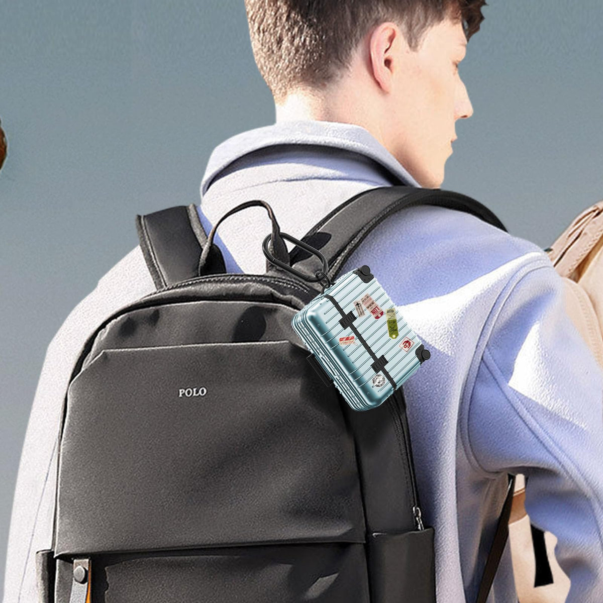 KOREDA AirPods Pro suitcase case comes with carabiner and ring for secure attachment.