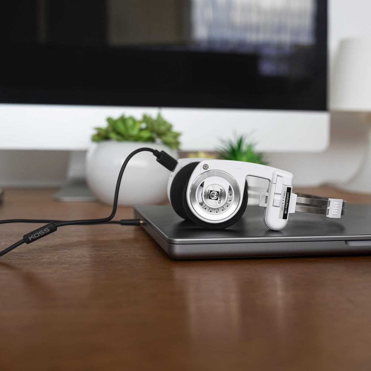 Koss KUSB-50 analog audio pass-through delivering pure sound.