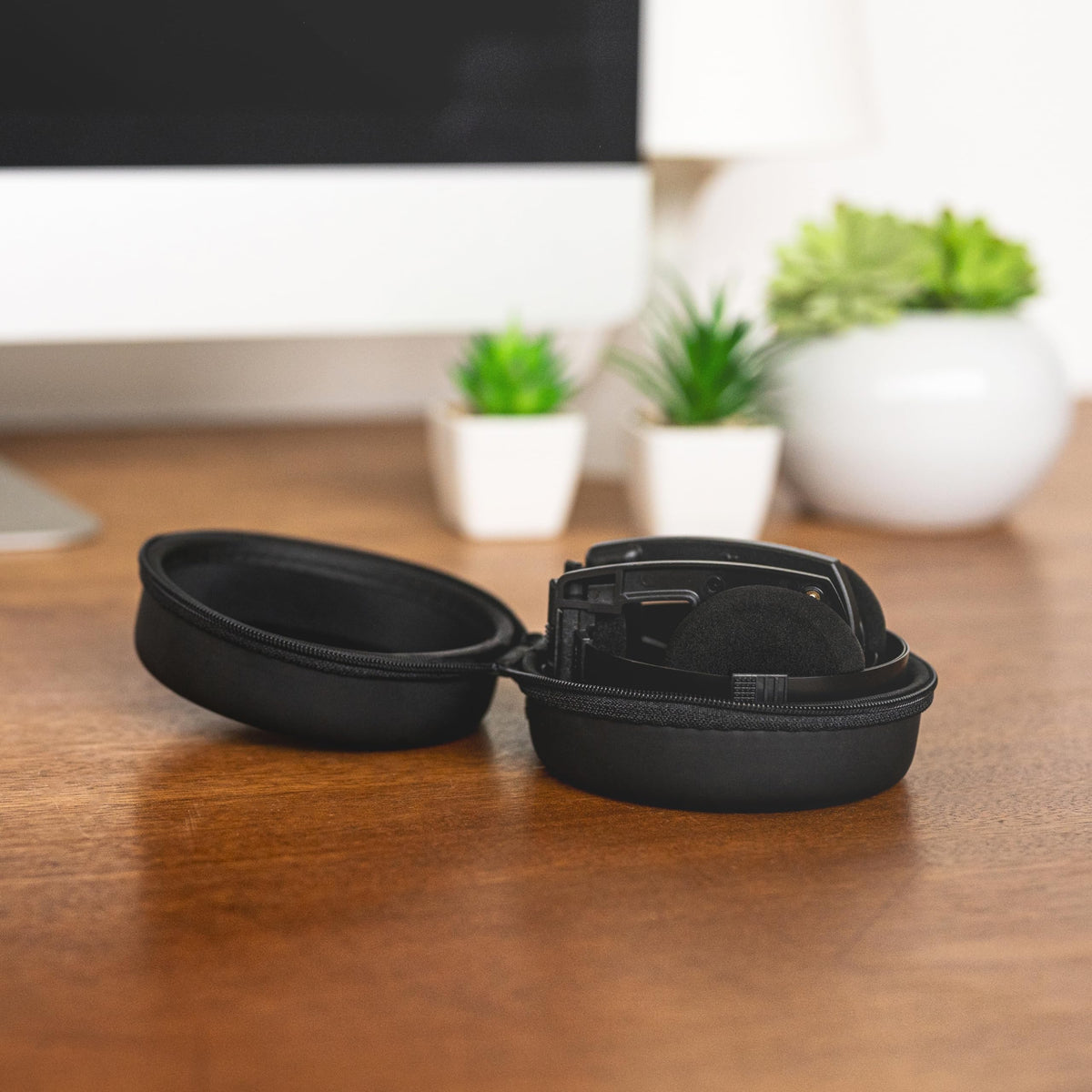 Koss case on a commuter table illustrating travel-ready protection and style