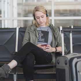 Koss Porta Pro worn on commuter, lifestyle scene showing convenience and clear calls