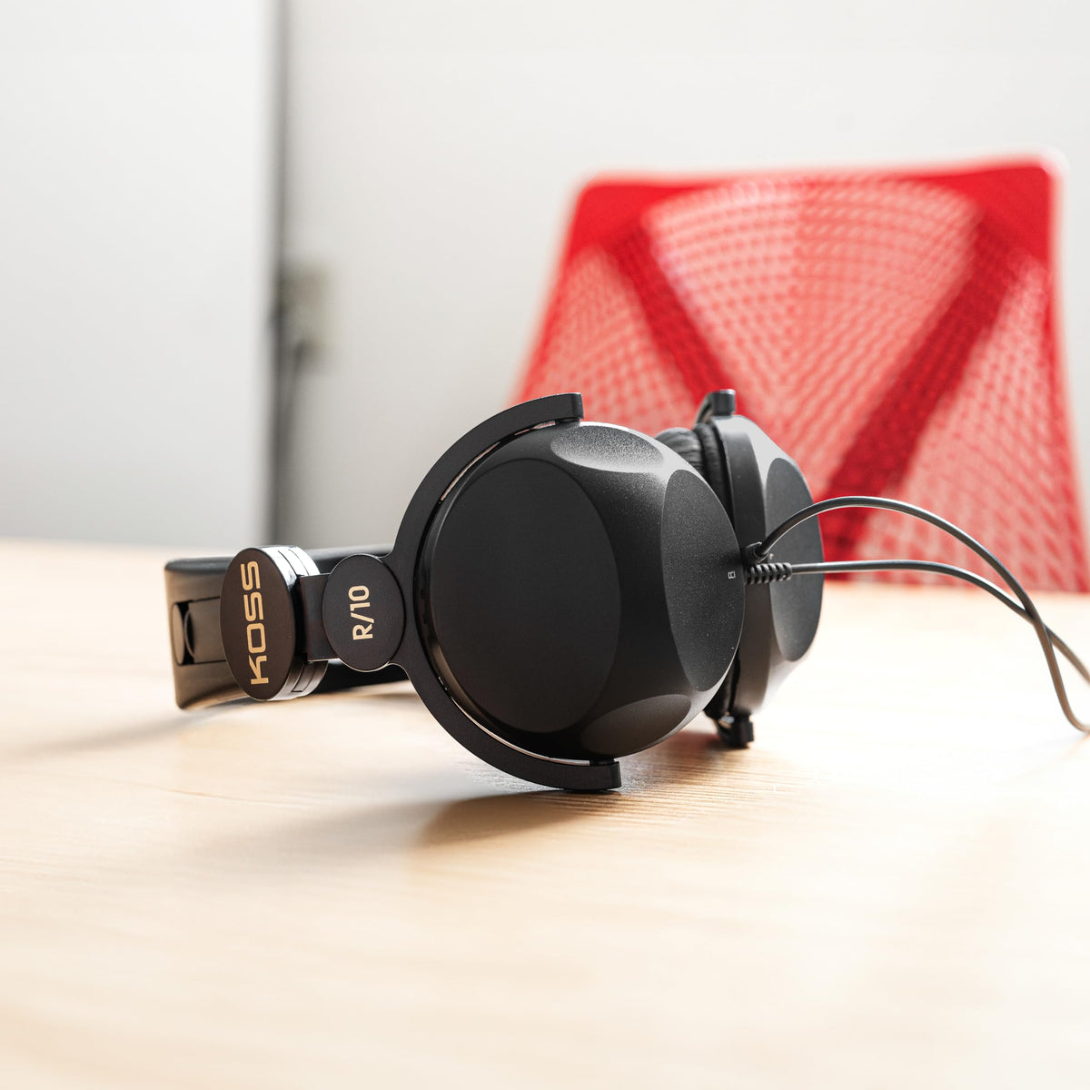 Koss R-10 headphones side view in black, classic style for everyday listening.
