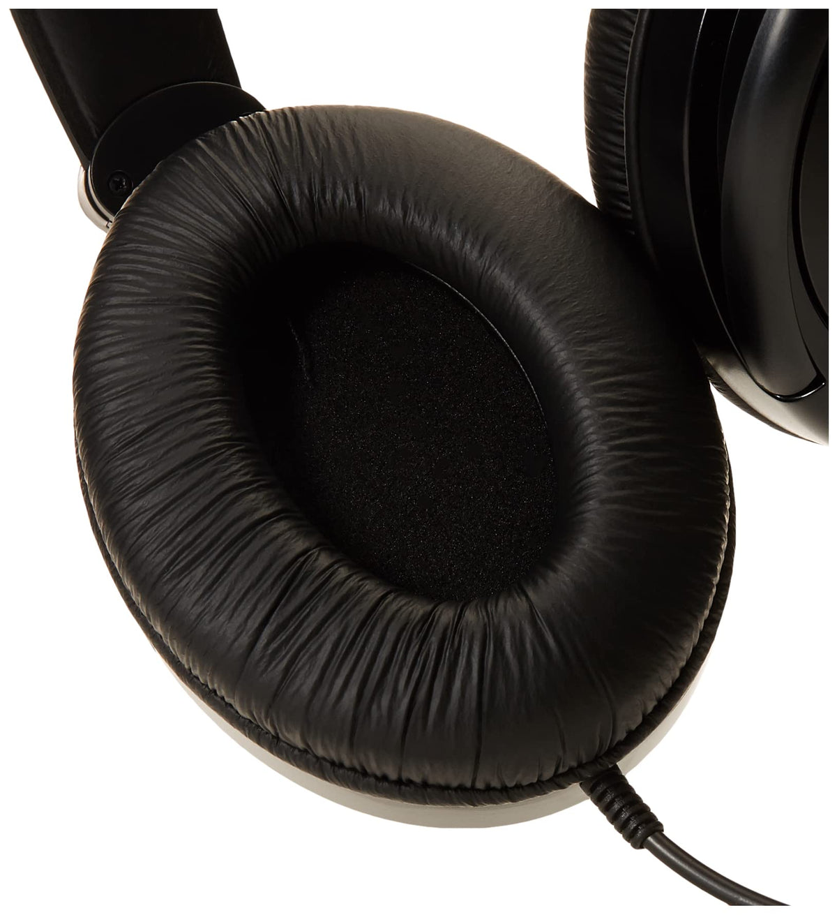 Koss R-80 on a couch in a living room setting illustrating comfortable home listening