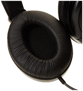 Koss R-80 on a couch in a living room setting illustrating comfortable home listening