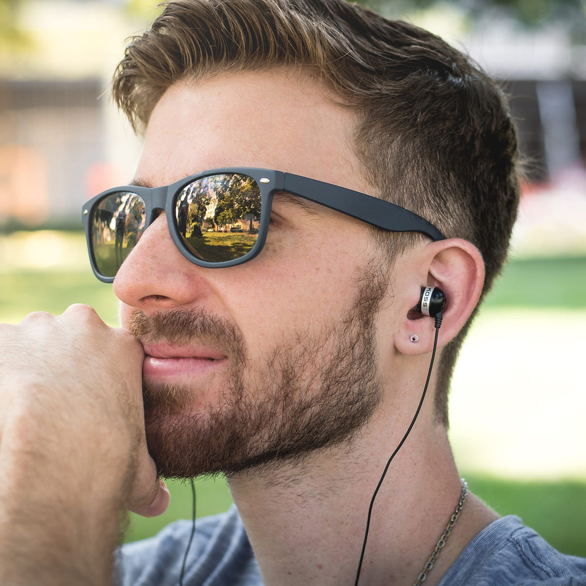 Koss The Plug beside ruler showing 4-foot cord length for convenient reach