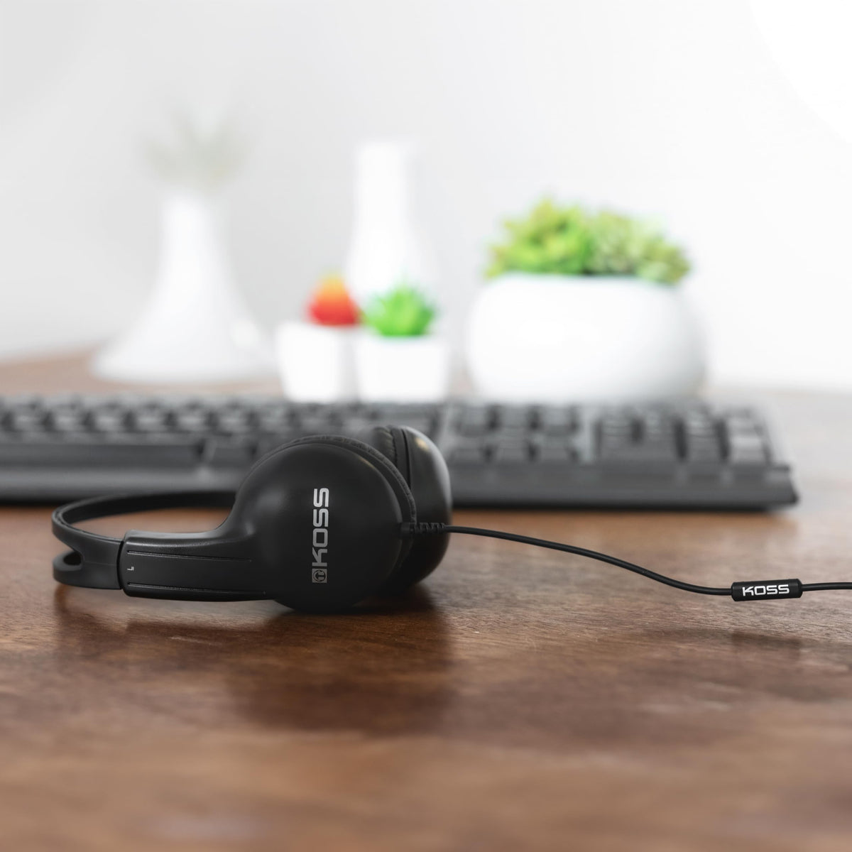 Koss UR10i inline microphone headphones in black for easy hands-free calls.