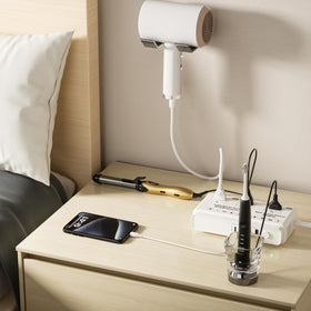 Kruuue next to passport and phone demonstrating compact travel-friendly size