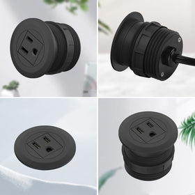 Close-up of recessed outlet keeping the desk surface uncluttered.
