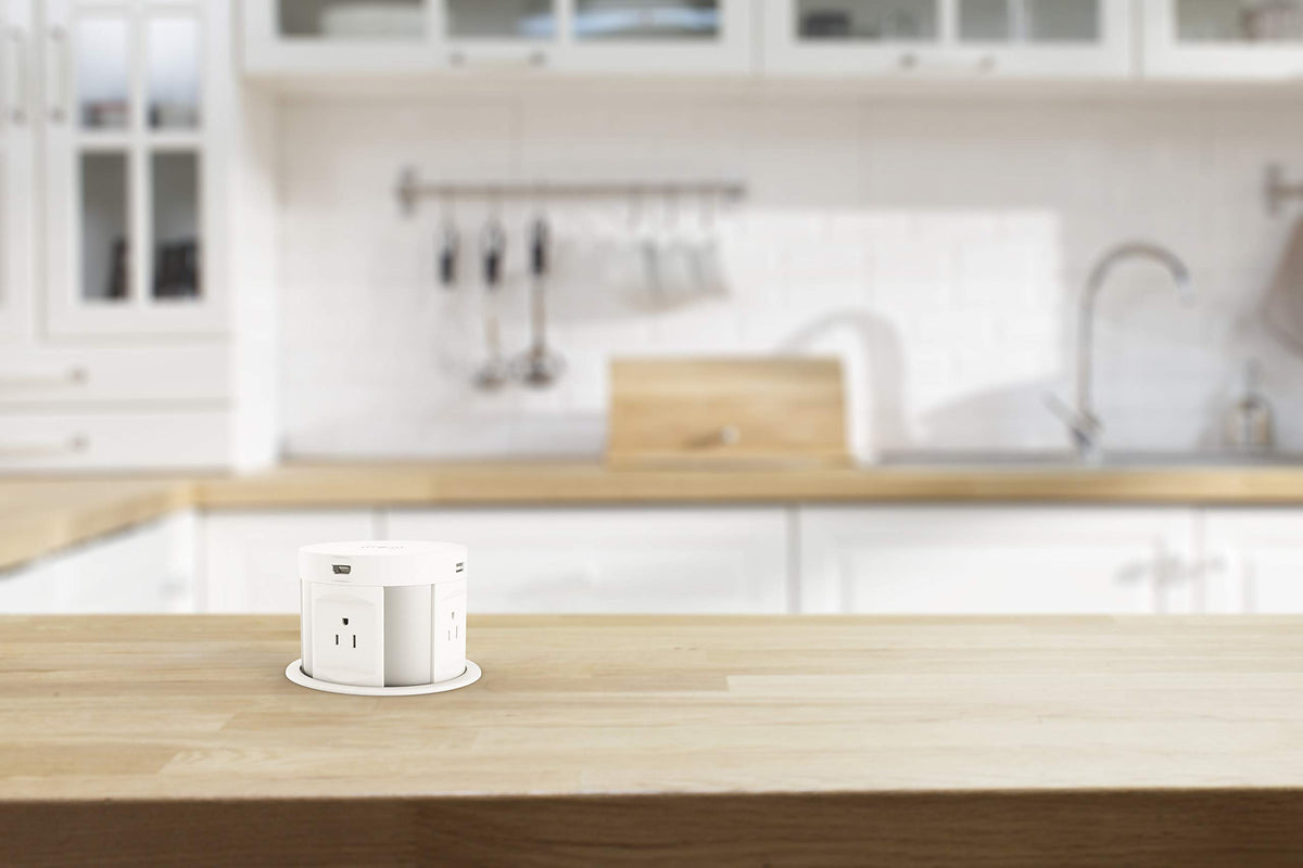 Kungfuking pop up outlet retracts flush into the surface for a seamless look.
