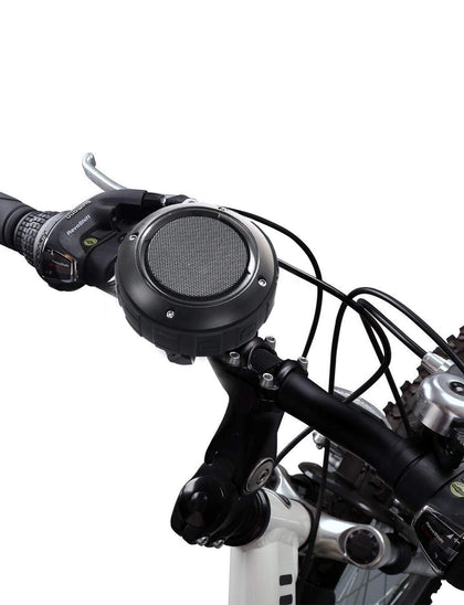 Kunodi outdoor Bluetooth speaker mounted on bike bracket for hands-free riding music.