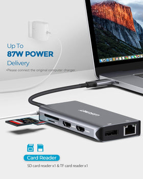 LASUNEY hub next to laptop for scale demonstrating slim design and portable convenience