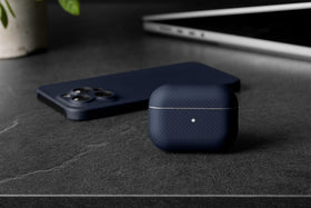 Latercase beside a coin showing 0.6mm thinness for pocket-friendly benefit