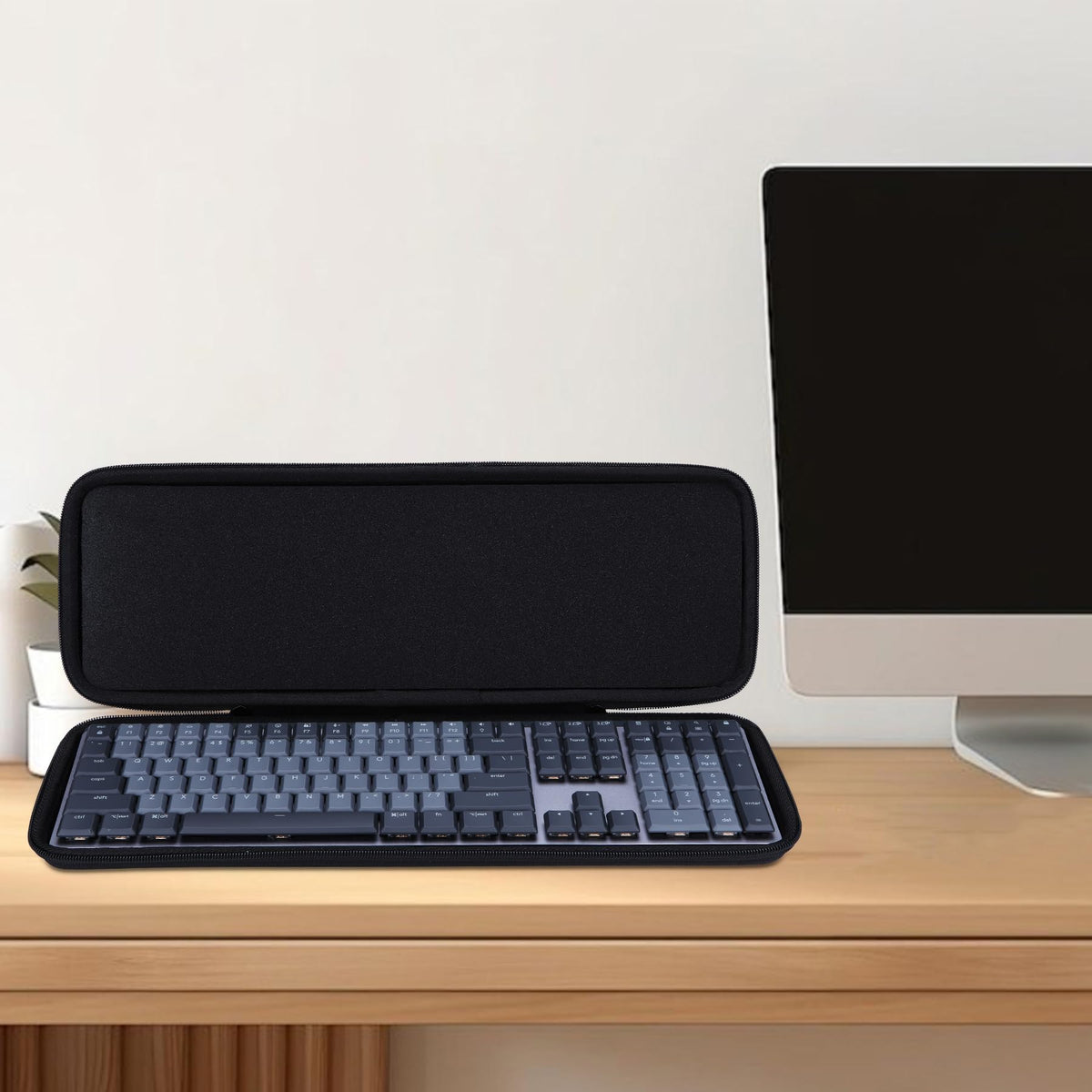 Lebakort case on desk in travel setup protecting keyboard