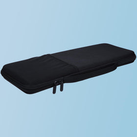 Lebakort next to backpack showing compact travel-friendly size